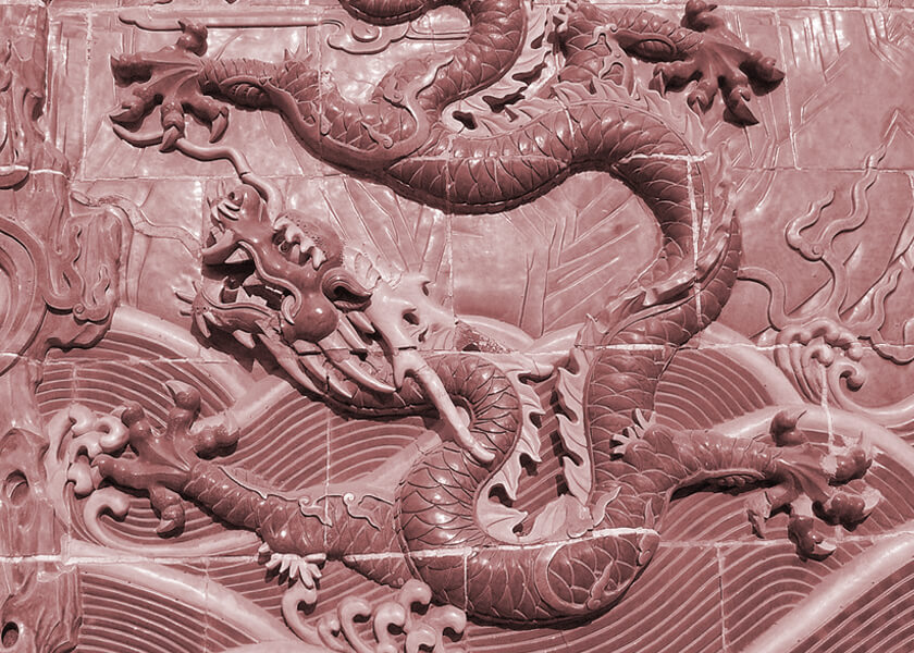 Five-clawed dragon on a Nine-Dragon Wall in Beihai Park, Beijing, China (Former Imperial Chinese palace and garden)